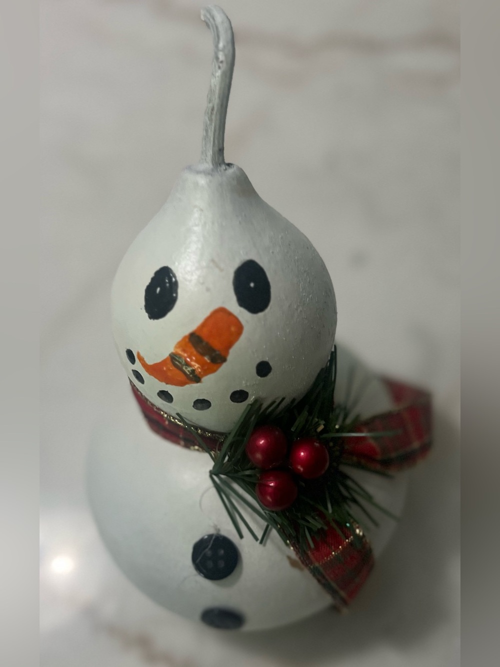 charming hand-painted snowman figurine crafted from a natural dried gourd